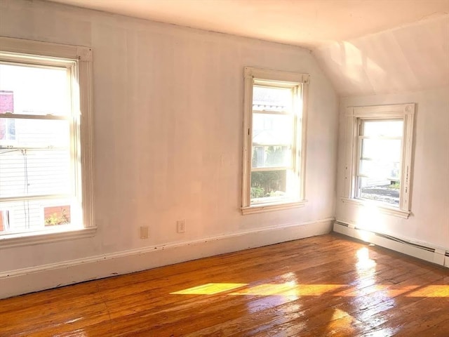 6-8 Imrie Rd, Boston, MA 02134 - additional living space with wood finished floors, lofted ceiling, plenty of natural light, and a baseboard radiator