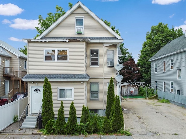 19-21 Pleasant Ter, Lawrence, MA 01841 - view of front of property featuring roof with shingles and driveway