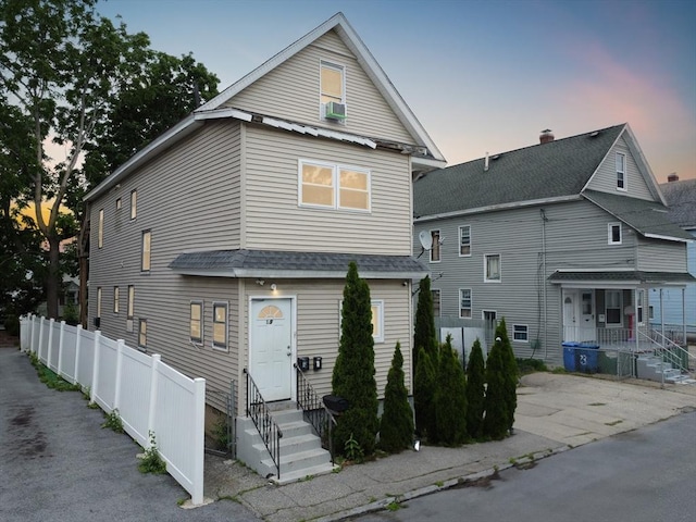 19-21 Pleasant Ter, Lawrence, MA 01841 - view of front of house featuring entry steps, a shingled roof, and cooling unit