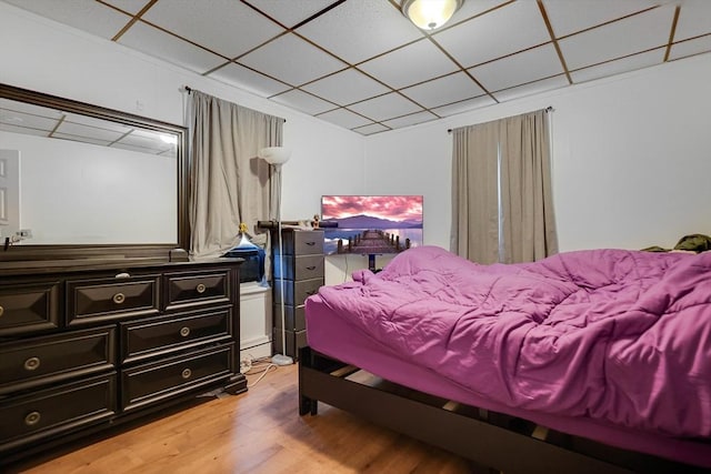 19-21 Pleasant Ter, Lawrence, MA 01841 - bedroom featuring a paneled ceiling and light wood-style flooring