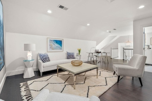 living room featuring recessed lighting, visible vents, vaulted ceiling, wood finished floors, and a chandelier