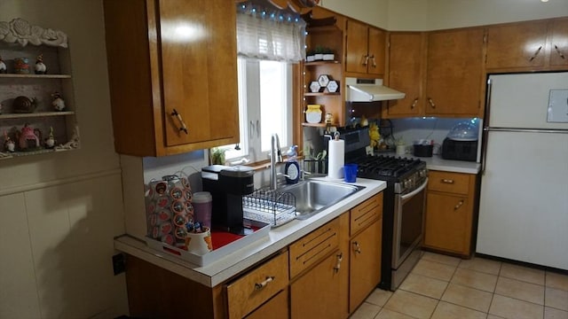 32 Bristol St, Ludlow, MA 01056 - kitchen featuring freestanding refrigerator, gas stove, open shelves, under cabinet range hood, and a sink