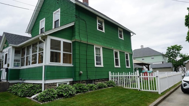 32 Bristol St, Ludlow, MA 01056 - view of side of home with a chimney and a sunroom