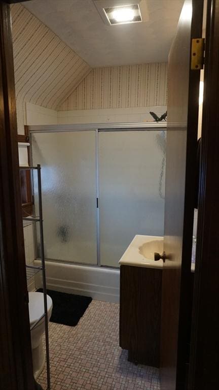 32 Bristol St, Ludlow, MA 01056 - full bathroom with toilet, enclosed tub / shower combo, vanity, and vaulted ceiling