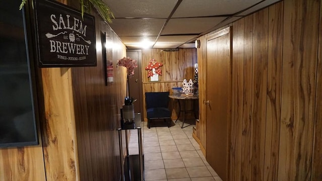 32 Bristol St, Ludlow, MA 01056 - hall featuring wooden walls and light tile patterned flooring