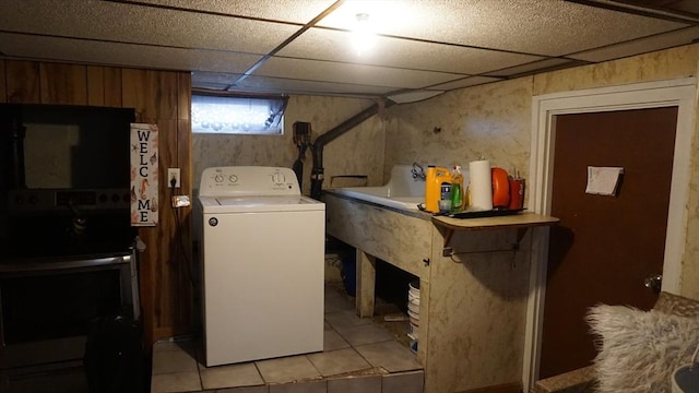 32 Bristol St, Ludlow, MA 01056 - laundry area with washer / dryer and light tile patterned floors