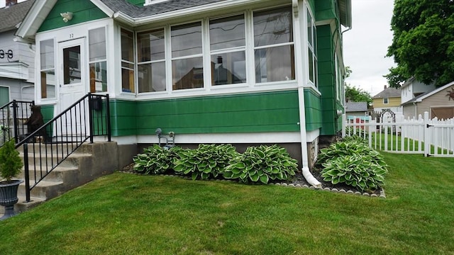 32 Bristol St, Ludlow, MA 01056 - view of property exterior with a sunroom and roof with shingles