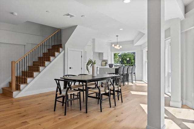 43 Stillman St Unit 201, Boston, MA 02113 - dining room featuring a notable chandelier, light wood-style flooring, stairs, recessed lighting, and visible vents