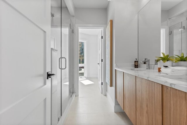 43 Stillman St Unit 201, Boston, MA 02113 - bathroom with double vanity, a sink, and a stall shower