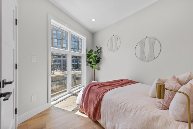 43 Stillman St Unit 201, Boston, MA 02113 - bedroom featuring baseboards, recessed lighting, light wood-style flooring, and access to exterior