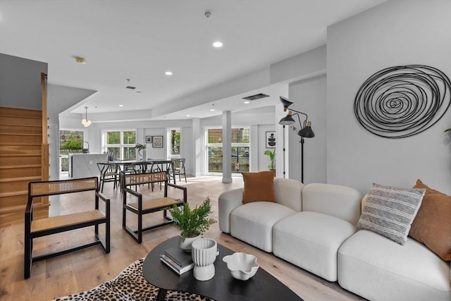 43 Stillman St Unit 201, Boston, MA 02113 - living area featuring recessed lighting, stairs, light wood-style flooring, and a healthy amount of sunlight