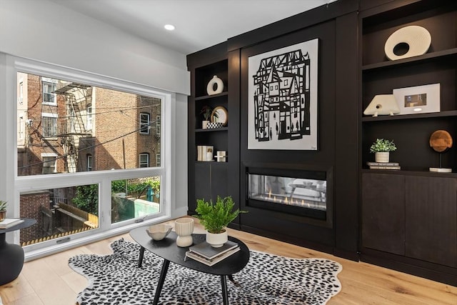 43 Stillman St Unit 201, Boston, MA 02113 - interior space featuring a glass covered fireplace, built in features, and wood finished floors