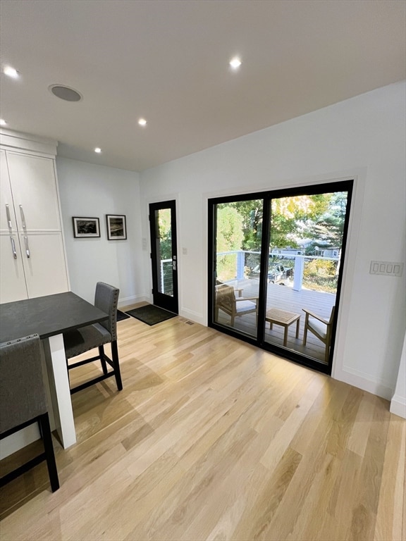 office area with light hardwood / wood-style floors