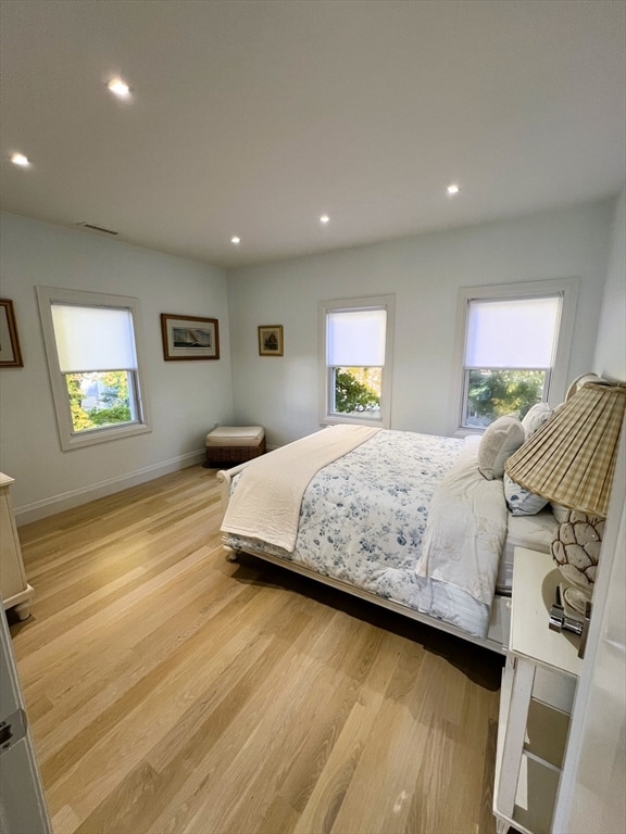 bedroom with light hardwood / wood-style flooring