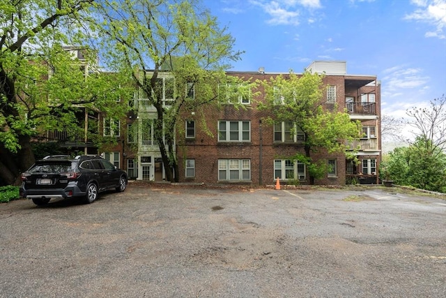 view of property with uncovered parking