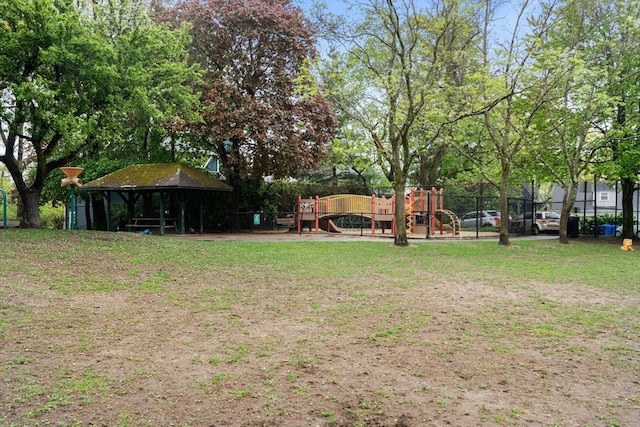 view of yard with playground community and fence