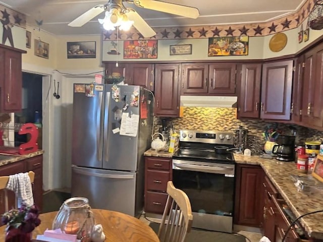 kitchen featuring light stone counters, backsplash, appliances with stainless steel finishes, ceiling fan, and under cabinet range hood