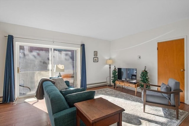 living room with baseboard heating and wood finished floors