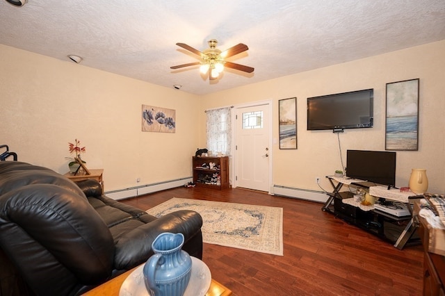 living room featuring ceiling fan, a textured ceiling, dark wood-type flooring, and a baseboard heating unit