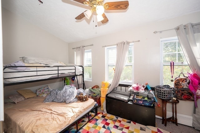 bedroom featuring ceiling fan, lofted ceiling, and carpet flooring