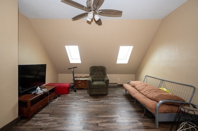 living area with vaulted ceiling with skylight, a baseboard radiator, dark hardwood / wood-style flooring, and ceiling fan