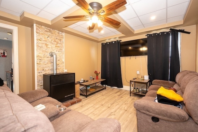 living room featuring ceiling fan and light hardwood / wood-style floors