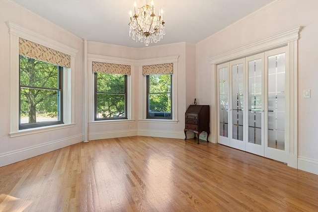 114 Fenway Unit 2, Boston, MA 02115 - empty room featuring wood finished floors, a chandelier, baseboards, and ornamental molding