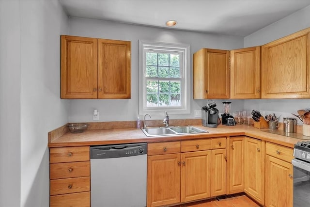 57 Center St, Dartmouth, MA 02748 - kitchen with appliances with stainless steel finishes, a sink, and light countertops