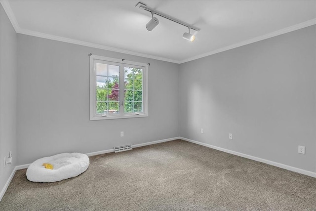 57 Center St, Dartmouth, MA 02748 - carpeted empty room featuring rail lighting, baseboards, and crown molding