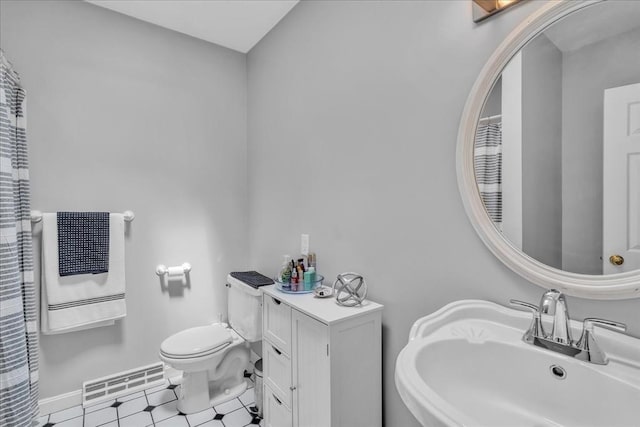 57 Center St, Dartmouth, MA 02748 - full bathroom with a sink, toilet, and heating unit