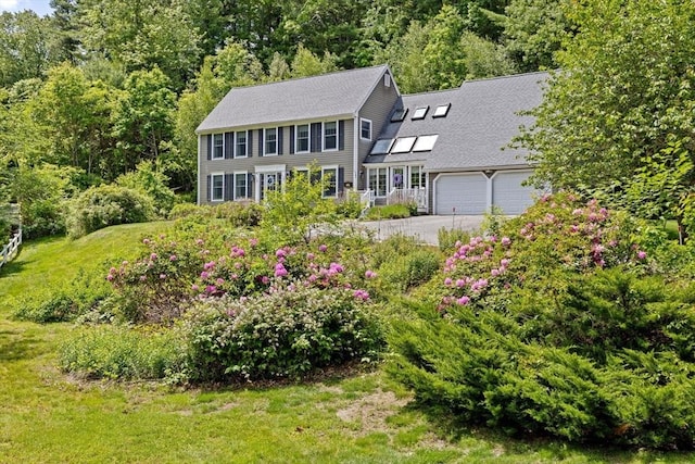 39 High Beacon Way, Marshfield, MA 02050 - colonial house featuring asphalt driveway, a garage, a view of trees, and a front lawn