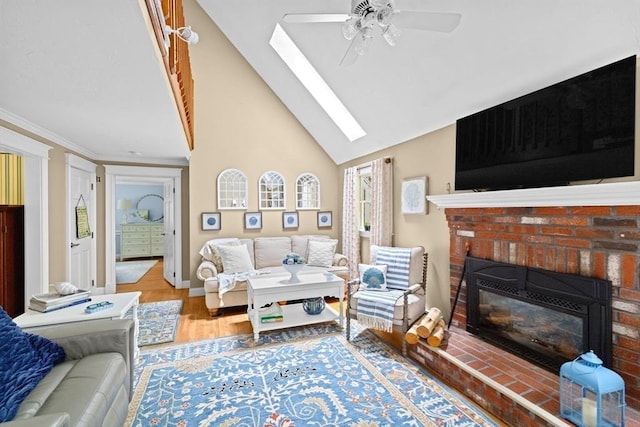 39 High Beacon Way, Marshfield, MA 02050 - living area with a skylight, a ceiling fan, a fireplace, wood finished floors, and high vaulted ceiling