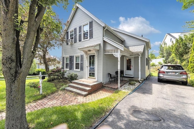 252 Railroad Ave, Norwood, MA 02062 - view of front of home featuring driveway, a front lawn, and cooling unit