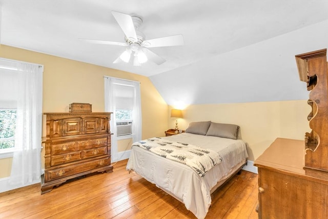 252 Railroad Ave, Norwood, MA 02062 - bedroom with light wood-type flooring, multiple windows, cooling unit, and lofted ceiling