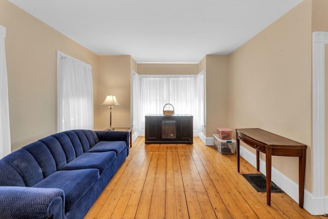 252 Railroad Ave, Norwood, MA 02062 - living room with light wood-style floors and baseboards