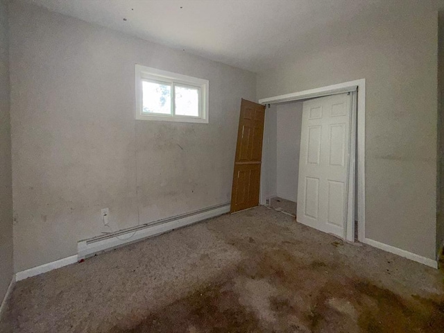 23 Eldert St, Springfield, MA 01109 - unfurnished bedroom with a baseboard heating unit, a closet, and carpet