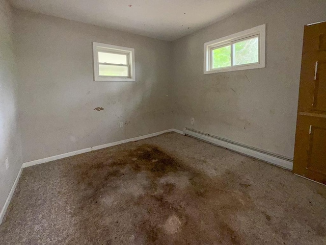23 Eldert St, Springfield, MA 01109 - carpeted empty room featuring a baseboard heating unit and plenty of natural light