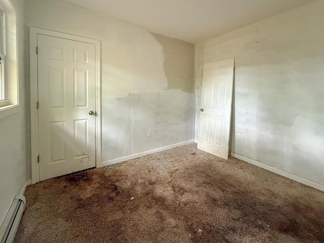 23 Eldert St, Springfield, MA 01109 - unfurnished bedroom featuring a baseboard heating unit and carpet flooring