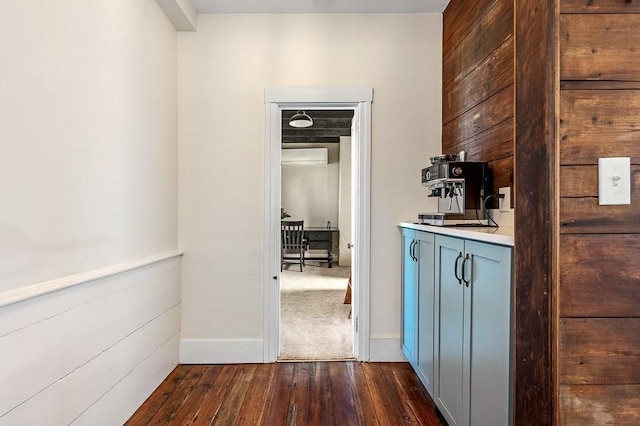 2 Oxford Pl, Worcester, MA 01609 - hallway with dark wood-type flooring, a wall unit AC, and baseboards