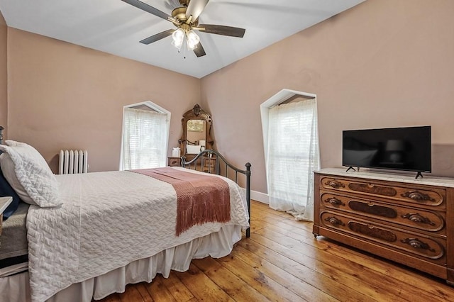 2 Oxford Pl, Worcester, MA 01609 - bedroom with radiator heating unit, hardwood / wood-style floors, and a ceiling fan
