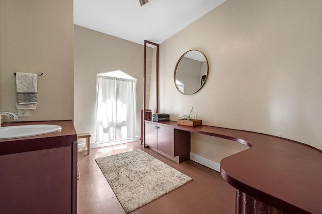 2 Oxford Pl, Worcester, MA 01609 - bathroom with vanity, lofted ceiling, tile patterned floors, and baseboards
