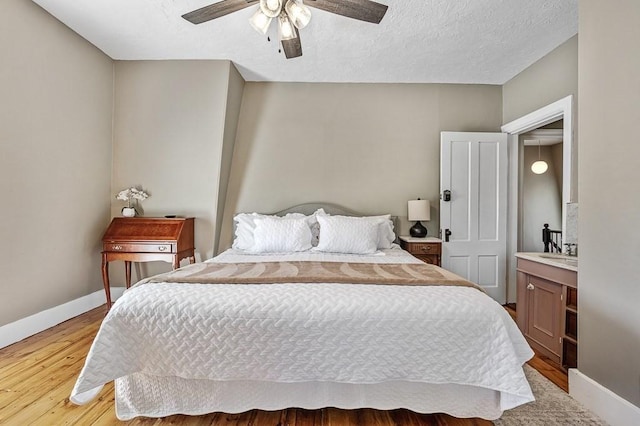 2 Oxford Pl, Worcester, MA 01609 - bedroom with baseboards, light wood-type flooring, a ceiling fan, and a textured ceiling