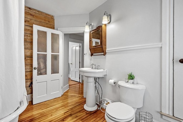 2 Oxford Pl, Worcester, MA 01609 - bathroom with toilet, wood finished floors, and wood walls