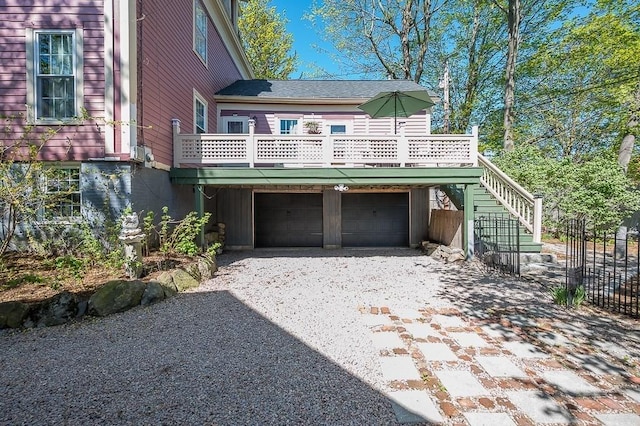2 Oxford Pl, Worcester, MA 01609 - view of front facade featuring driveway, an attached garage, and stairway