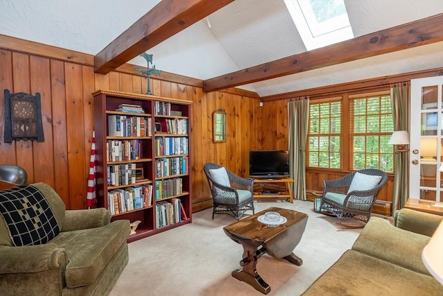 21 Overlook Dr, Chelmsford, MA 01824 - carpeted living room with wood walls and a skylight