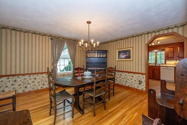 21 Overlook Dr, Chelmsford, MA 01824 - dining area with wallpapered walls, light wood finished floors, a chandelier, and healthy amount of natural light