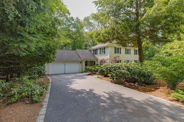 21 Overlook Dr, Chelmsford, MA 01824 - view of front of house with asphalt driveway and an attached garage