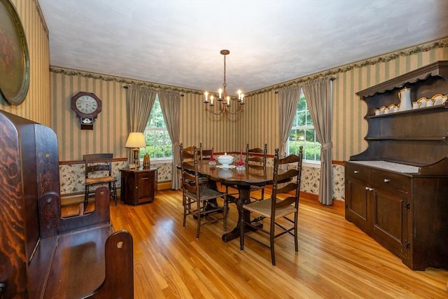 21 Overlook Dr, Chelmsford, MA 01824 - dining room featuring wallpapered walls, a chandelier, light wood finished floors, and plenty of natural light