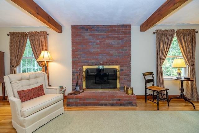 21 Overlook Dr, Chelmsford, MA 01824 - living room with beamed ceiling, wood finished floors, and a brick fireplace