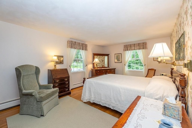 21 Overlook Dr, Chelmsford, MA 01824 - bedroom with a baseboard heating unit and wood finished floors